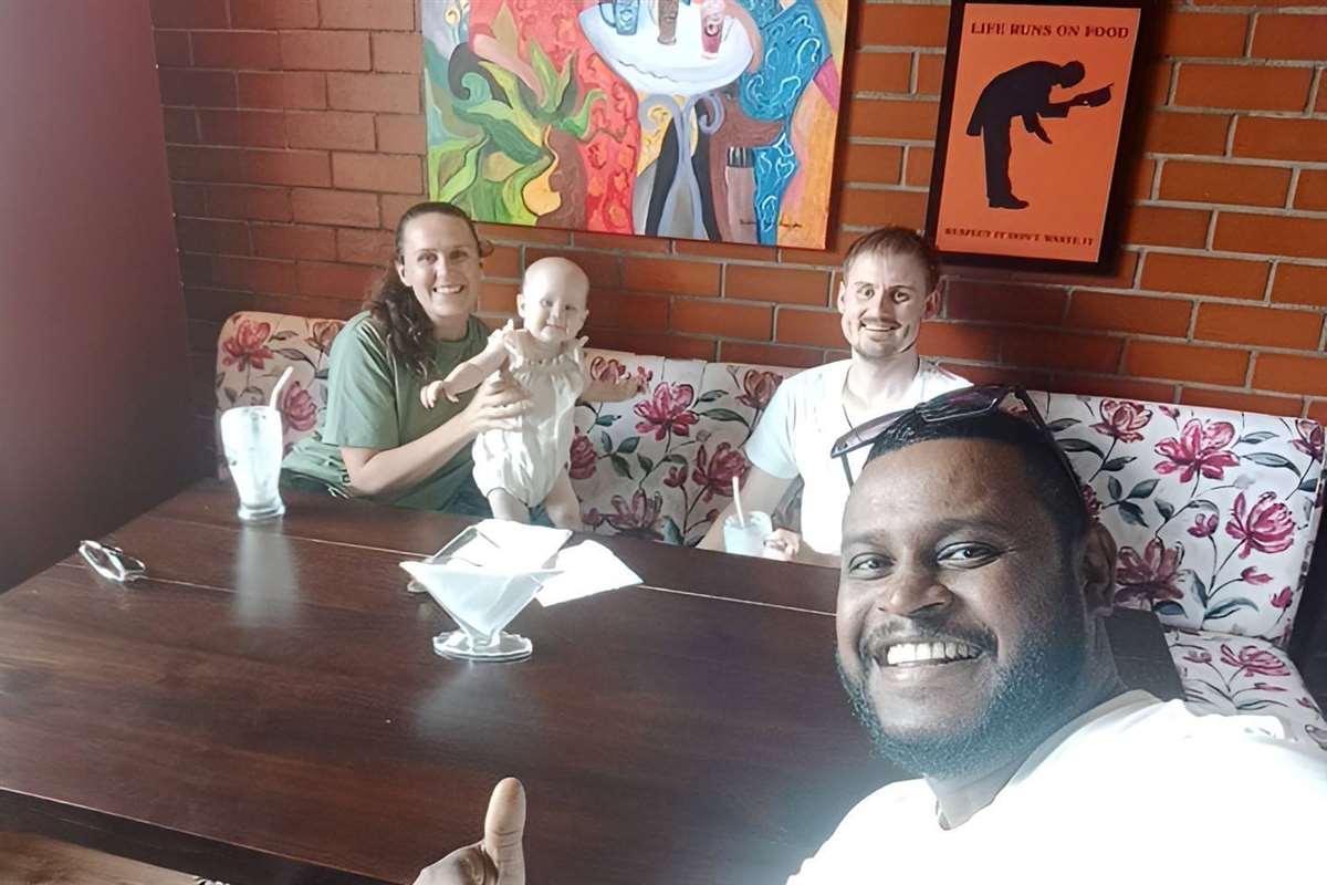Traveler selfie with guests