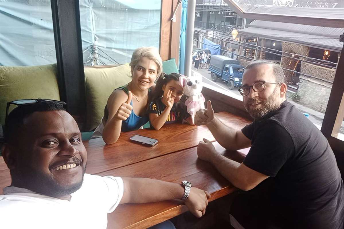 Travelers with a baby at a restaurant